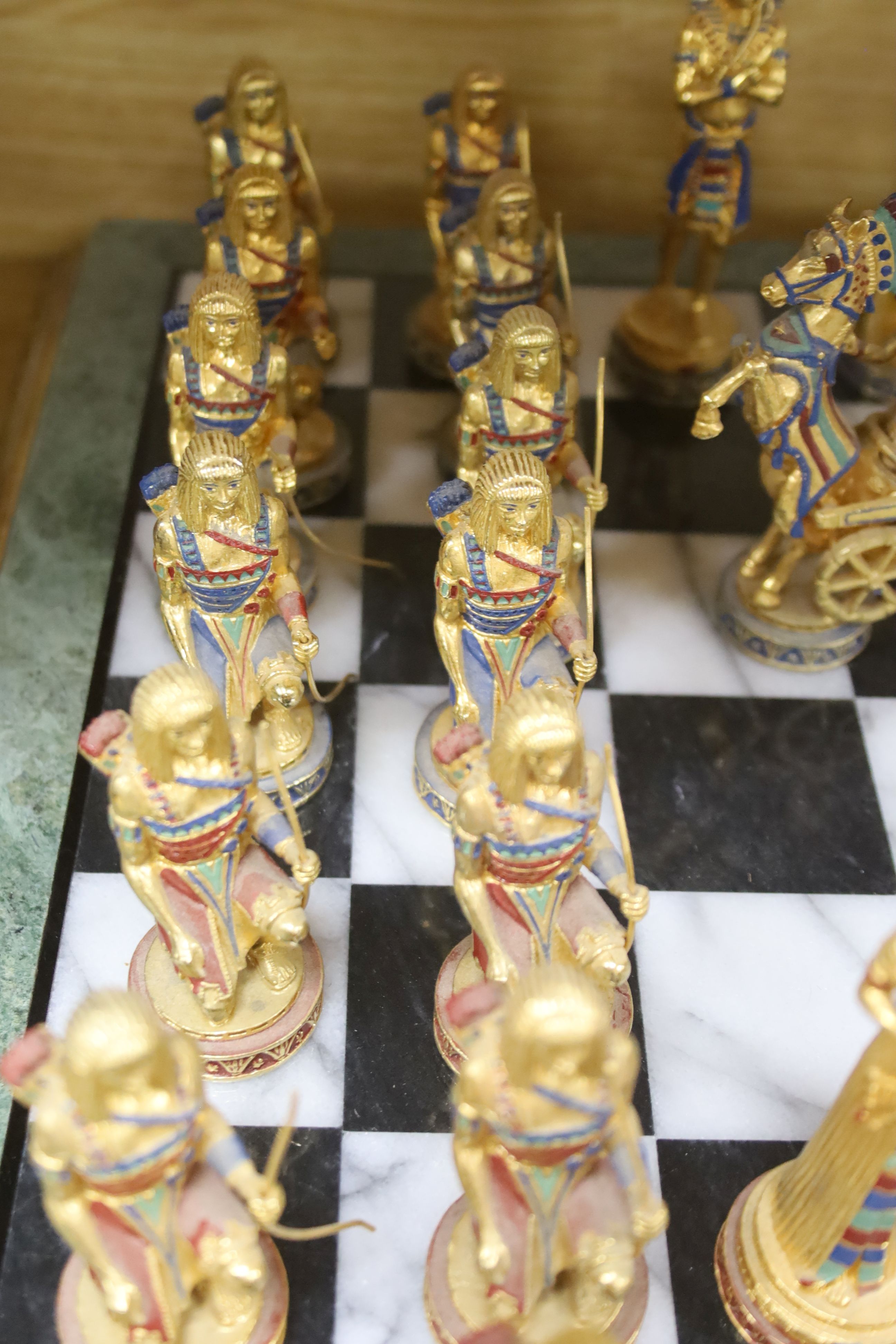 A contemporary chess board and pieces, Egyptian theme